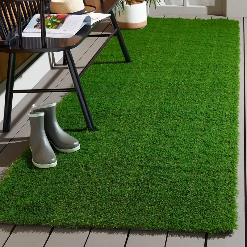 Artificial turf carpet enhancing a residential patio space
