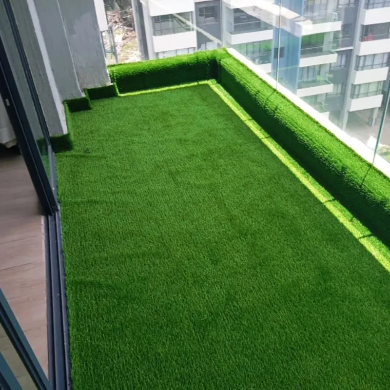 Green artificial grass carpet with natural balcony appearance